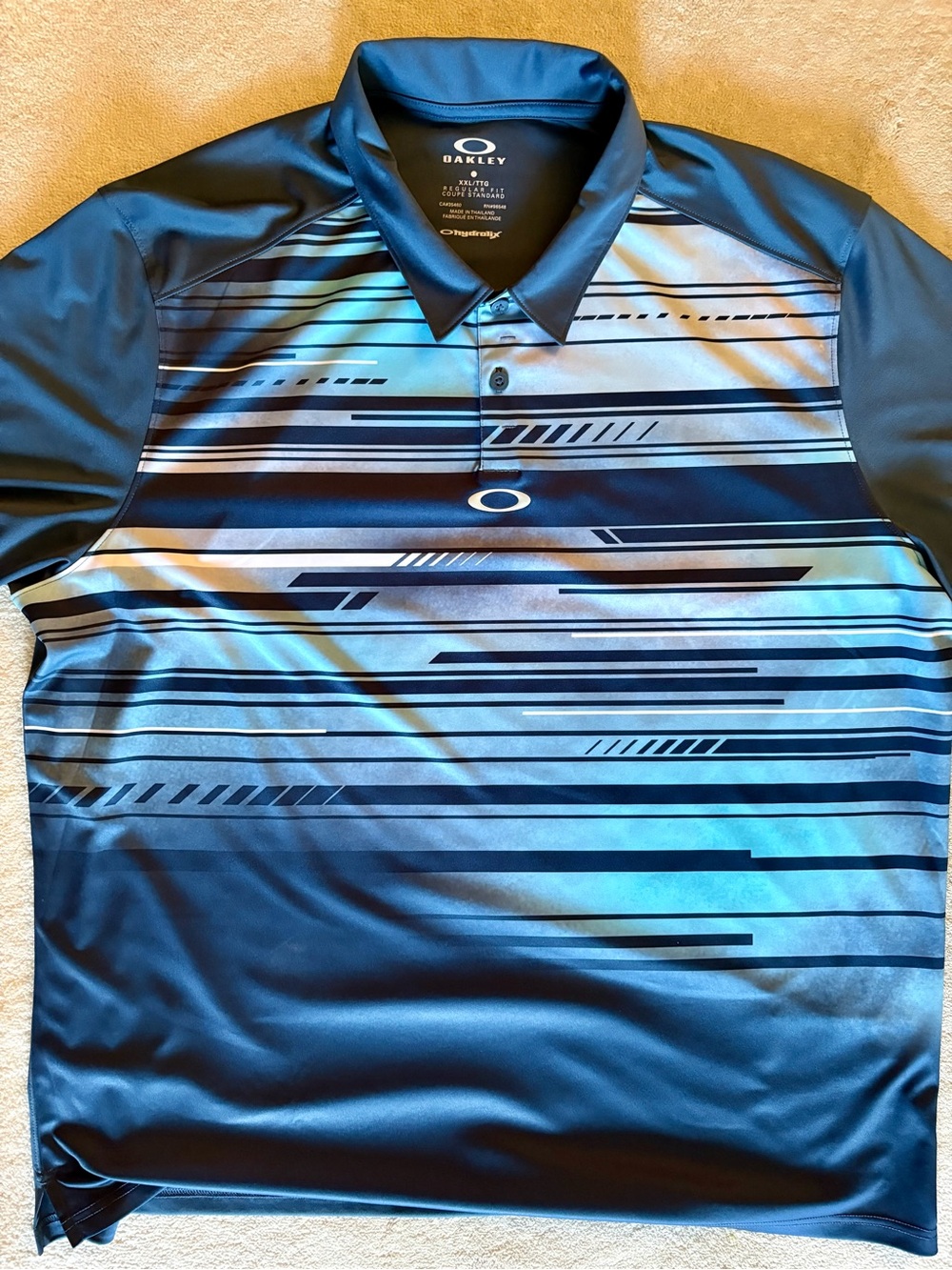 Oakley Men's Navy and Light Blue Striped Performance Polo
